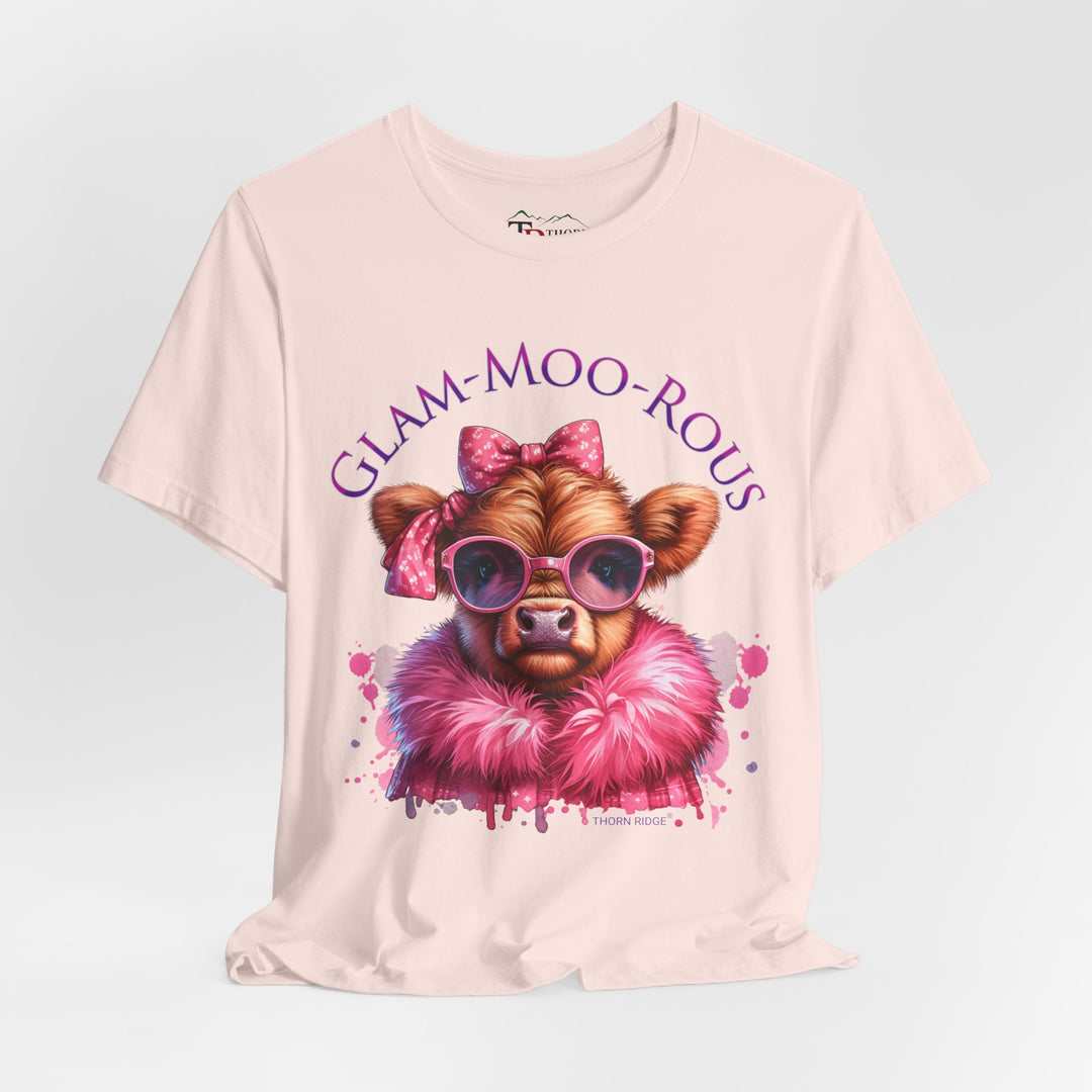 "Glam-Moo-Rous" Graphic Tee with a  Cow in Pink with pink sunglasses and pink bows on her head and a pink boa around her neck. Labeled Thorn Ridge®