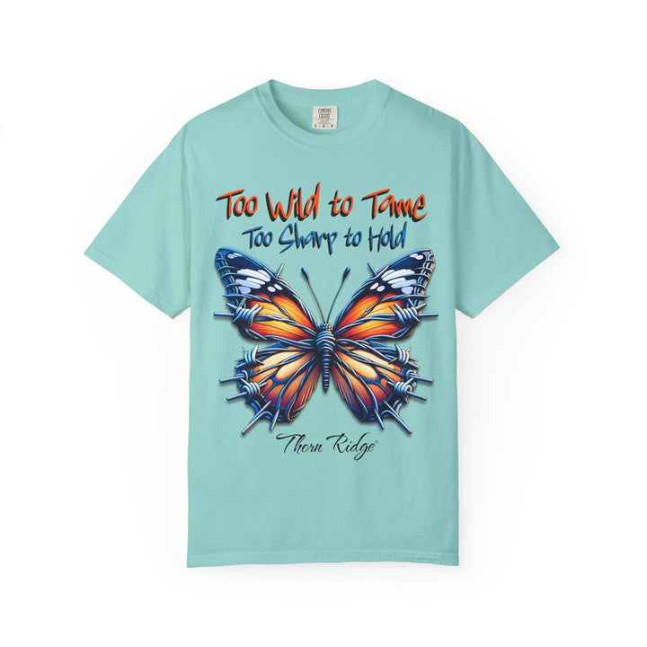 Too Wild To Tame Too Sharp To Hold Graphic Tee with a butterfly with barbed wire wings labeled Thorn Ridge.