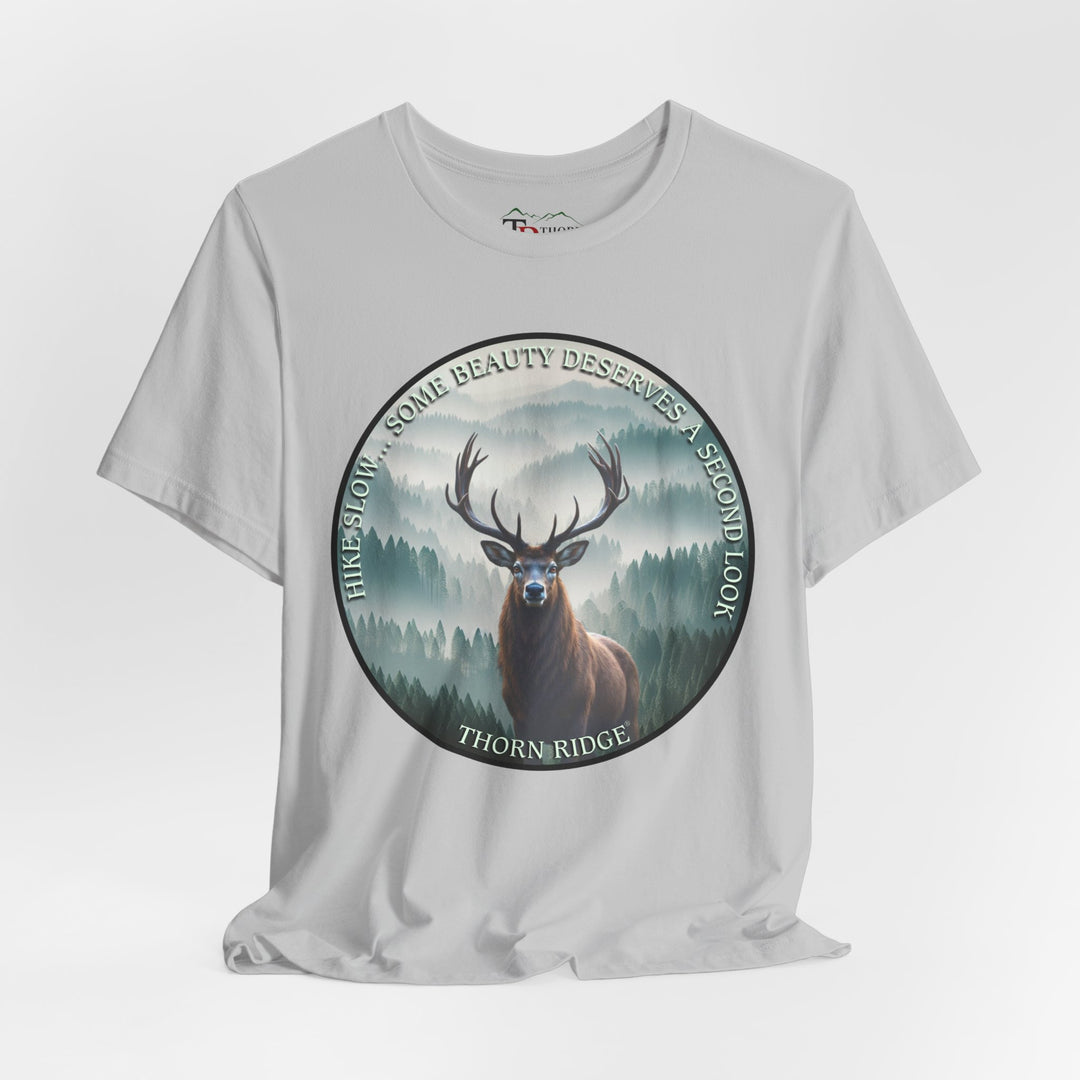 Hike Slow Some Beauty Deserves a Second Look tee with deer and mountains within a circular graphic by Thorn Ridge®