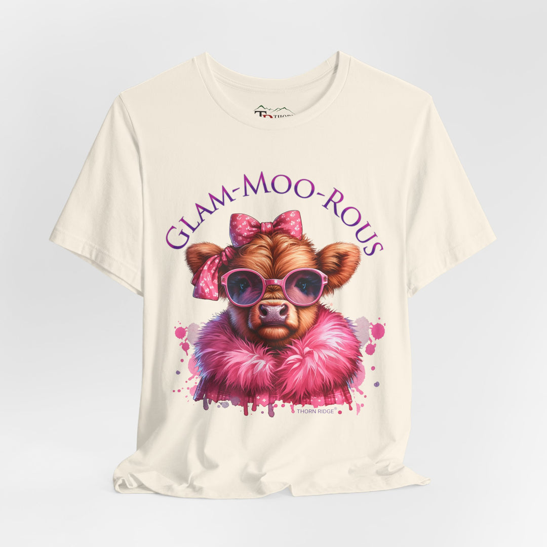 "Glam-Moo-Rous" Graphic Tee with a  Cow in Pink with pink sunglasses and pink bows on her head and a pink boa around her neck. Labeled Thorn Ridge®