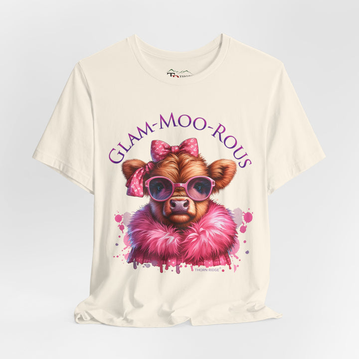 "Glam-Moo-Rous" Graphic Tee with a  Cow in Pink with pink sunglasses and pink bows on her head and a pink boa around her neck. Labeled Thorn Ridge®