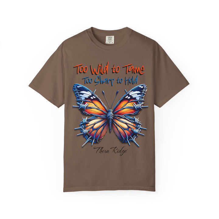 Too Wild To Tame Too Sharp To Hold Graphic Tee with a butterfly with barbed wire wings labeled Thorn Ridge.