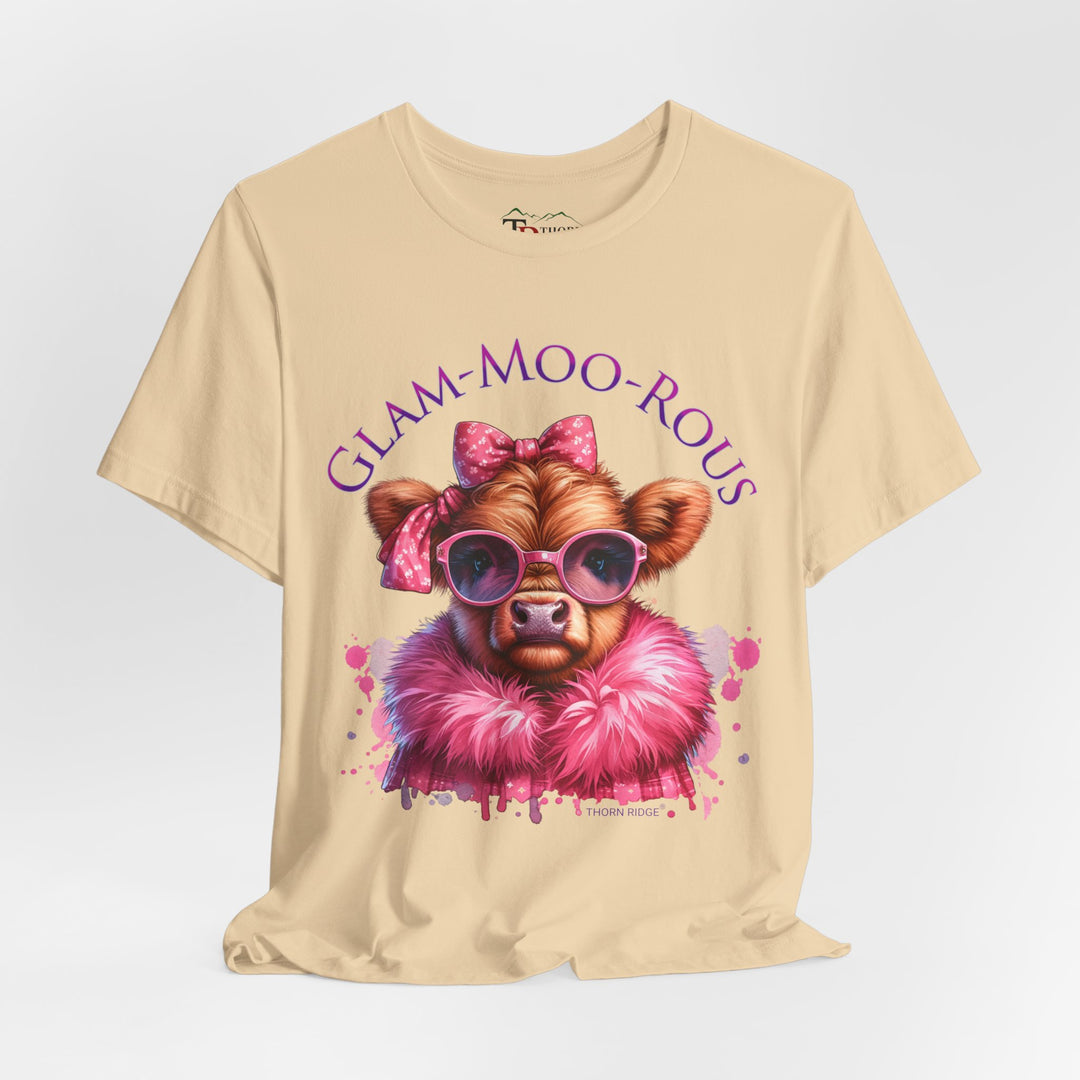 "Glam-Moo-Rous" Graphic Tee with a  Cow in Pink with pink sunglasses and pink bows on her head and a pink boa around her neck. Labeled Thorn Ridge®