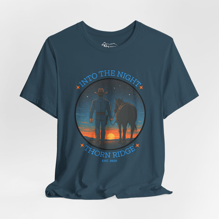 t-shirt with 'Into the Night' and 'Thorn Ridge' graphic design of a cowboy leading his horse into the setting sun as night is falling.