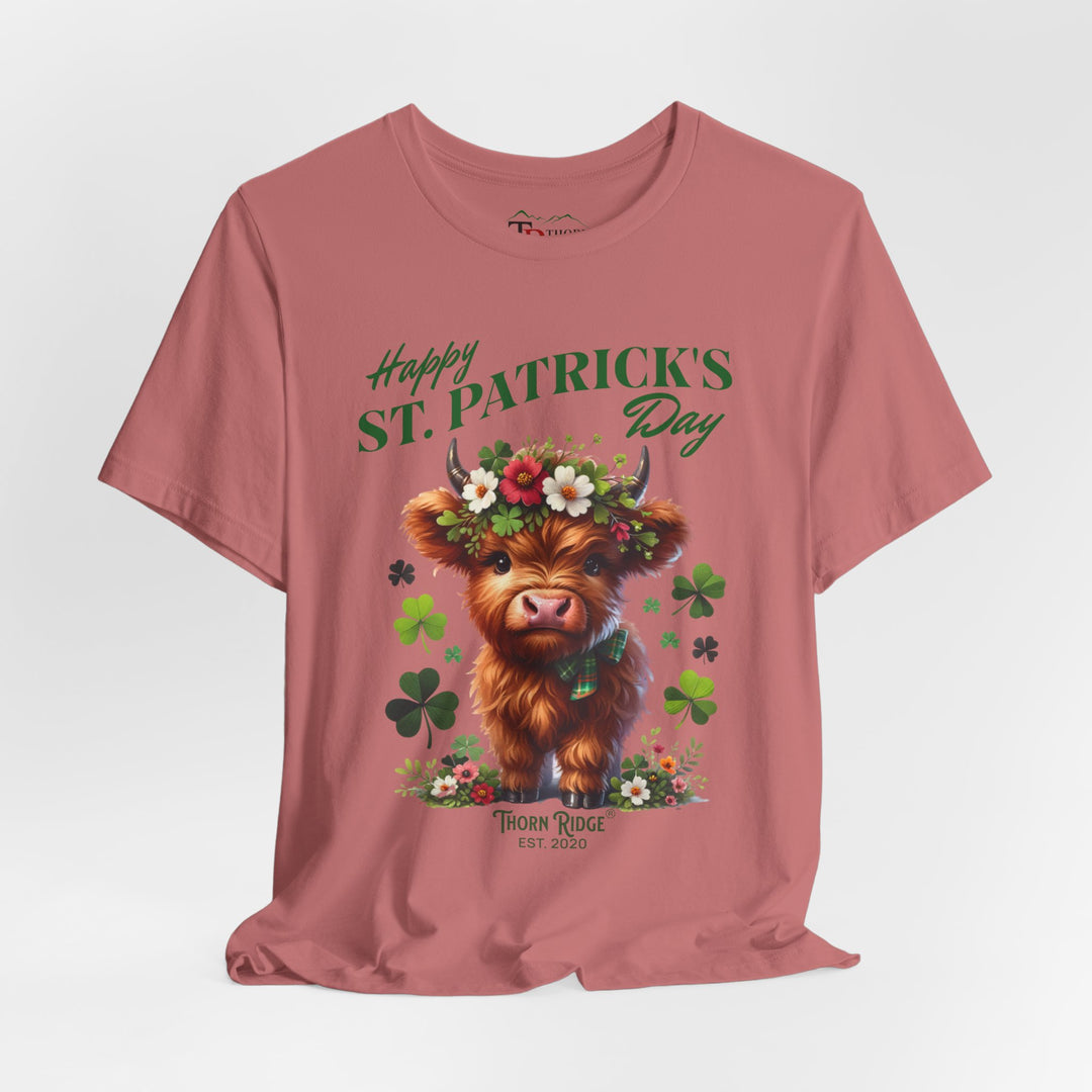 St. Patrick's Day Graphic Tee featuring a highland baby cow with flowers and clovers.