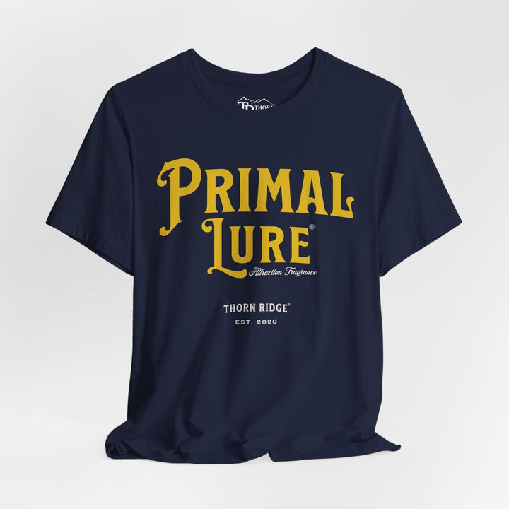 t-shirt with the text 'PRIMAL LURE' in bold yellow letters and 'THORN RIDGE EST. 2000' in smaller text below it.