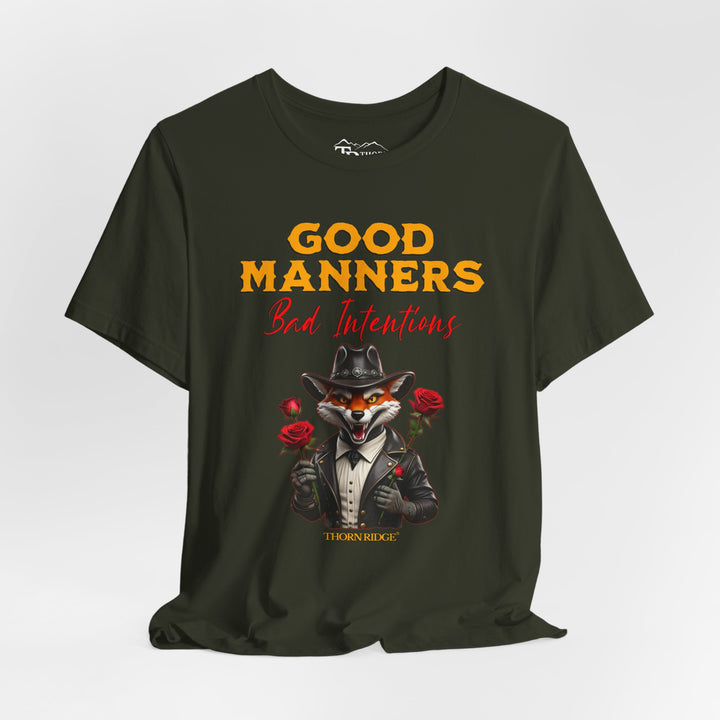 Good manners bad intentions graphic tee with a grinning fox wearing a black cowboy hat and leather jacket with human hands holding roses.  labeled Thorn Ridge®