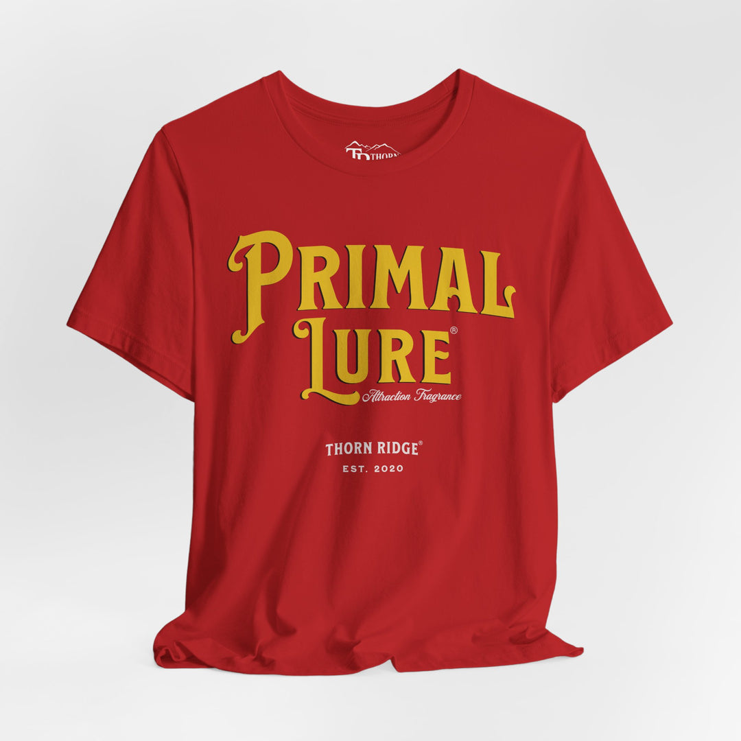 t-shirt with the text 'PRIMAL LURE' in bold yellow letters and 'THORN RIDGE EST. 2000' in smaller text below it.