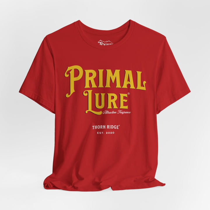 t-shirt with the text 'PRIMAL LURE' in bold yellow letters and 'THORN RIDGE EST. 2000' in smaller text below it.
