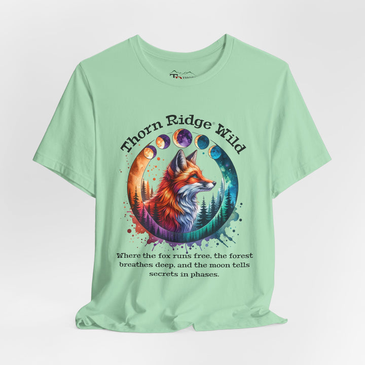 Thorn Ridge Wild Graphic Tee featuring a fox, forest, and moon phases.