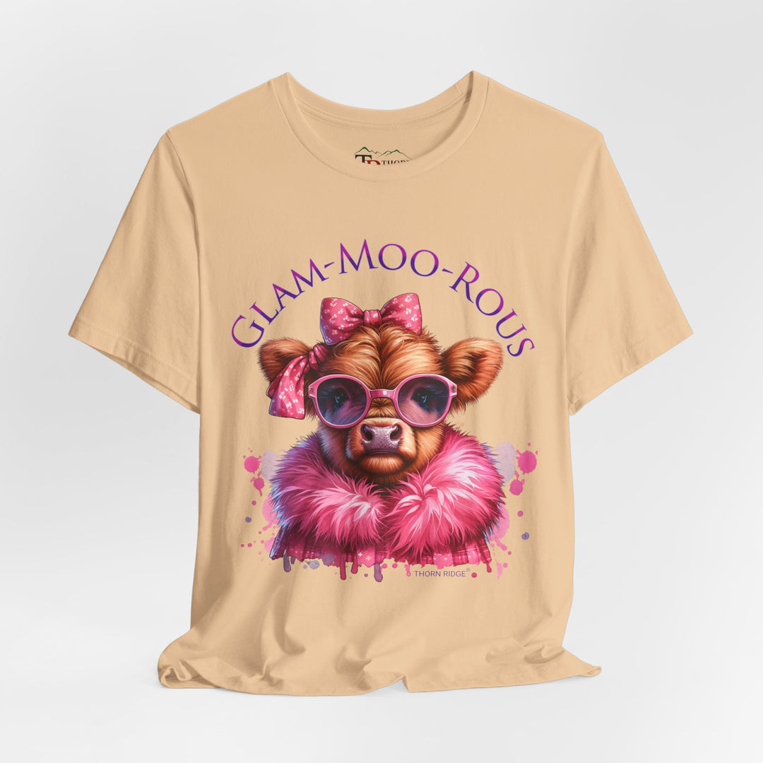 "Glam-Moo-Rous" Graphic Tee with a  Cow in Pink with pink sunglasses and pink bows on her head and a pink boa around her neck. Labeled Thorn Ridge®