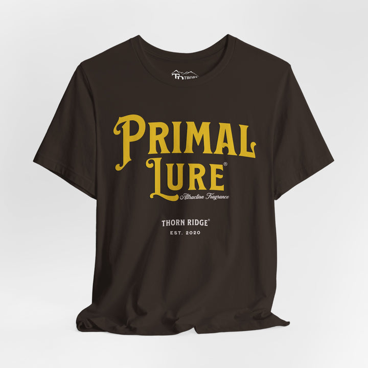t-shirt with the text 'PRIMAL LURE' in bold yellow letters and 'THORN RIDGE EST. 2000' in smaller text below it.