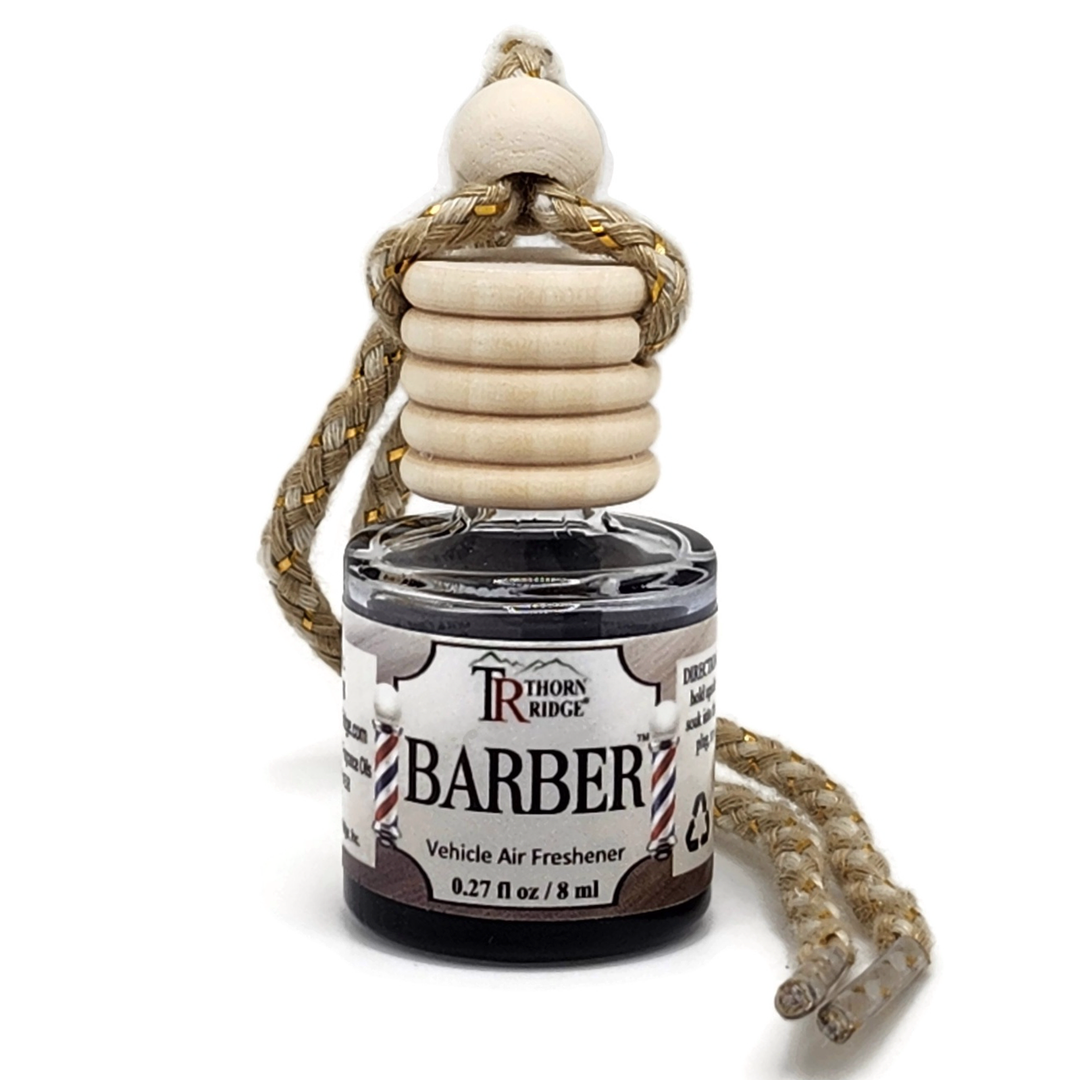 Thorn Ridge® Barber Car Air Freshener Round bottle with wooden top and gold threaded cord.