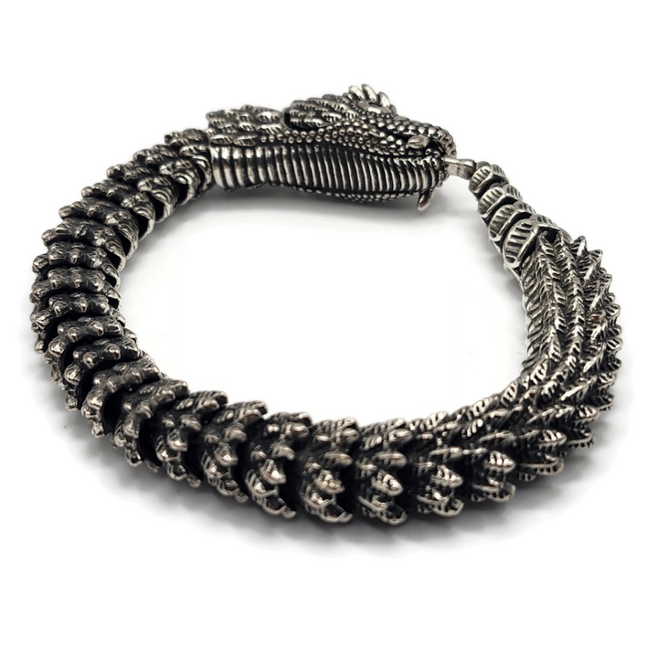 Dragon snake style metal alloy bracelet in silver and gold.