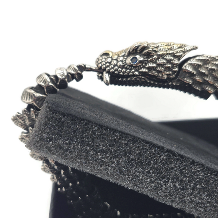 Dragon snake style metal alloy bracelet in silver and gold.