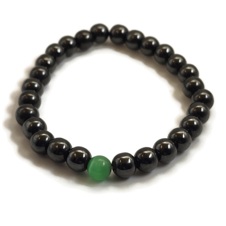 Magnetic bracelet with a green gemstone.
