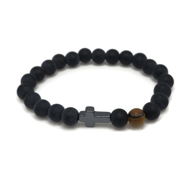 cross bracelet made of black agate and features a tiger eye gemstone.