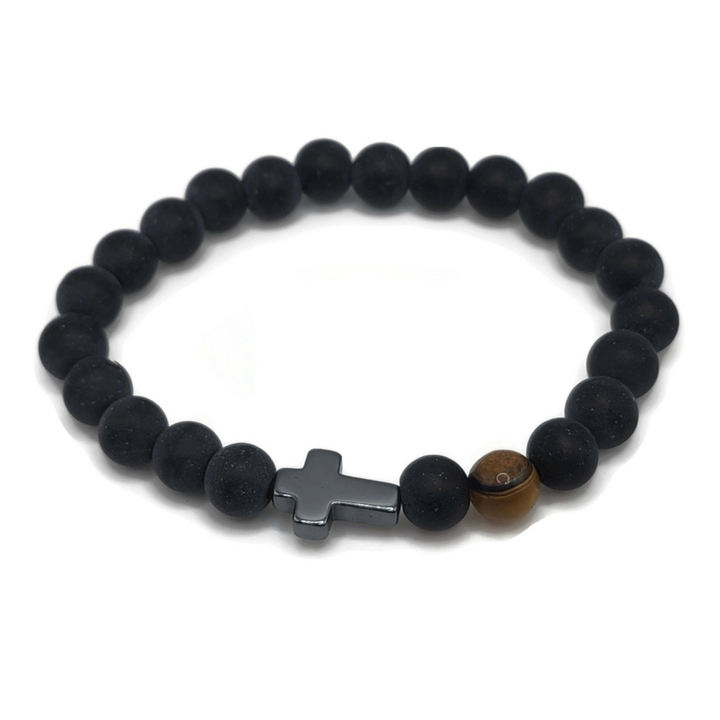 cross bracelet made of black agate and features a tiger eye gemstone.