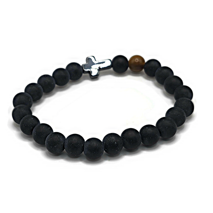 cross bracelet made of black agate and features a tiger eye gemstone.