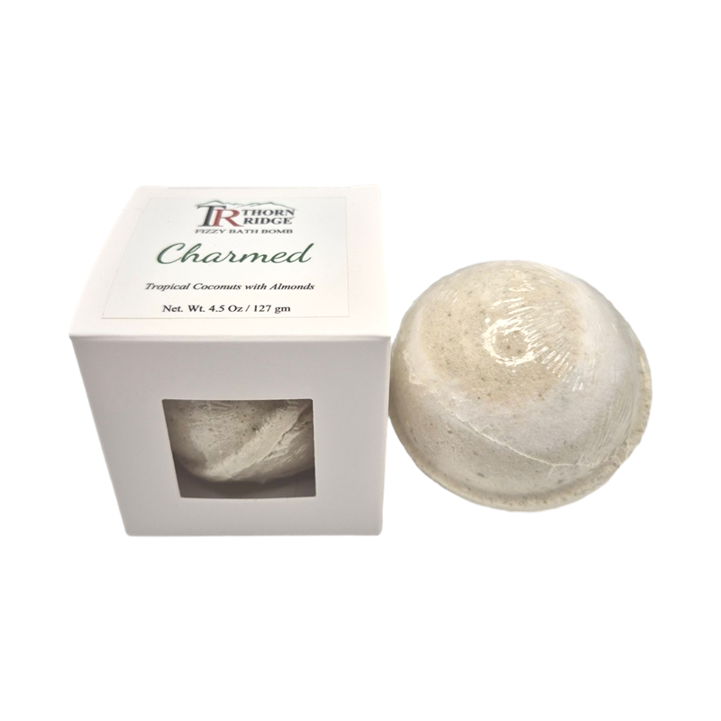 Charmed bath bomb front with box packaging.