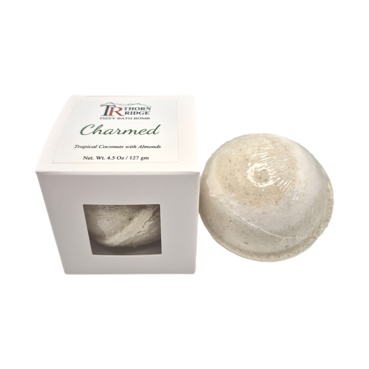 Charmed bath bomb front with box packaging.
