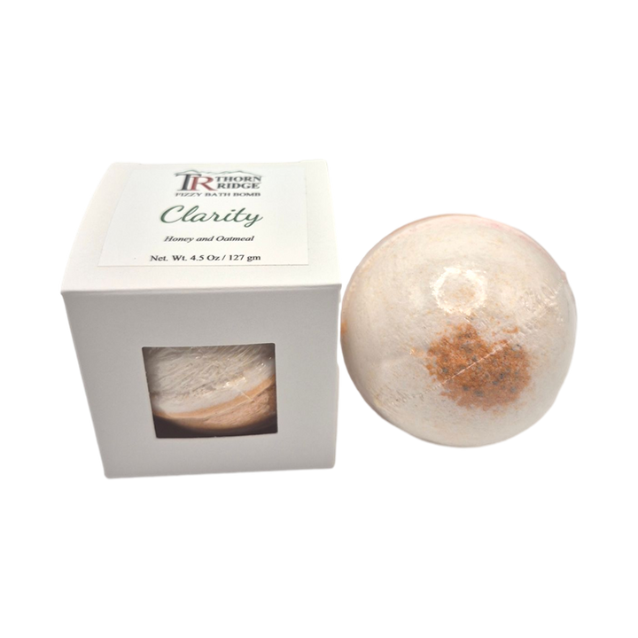 Clarity bath bomb front with box packaging.