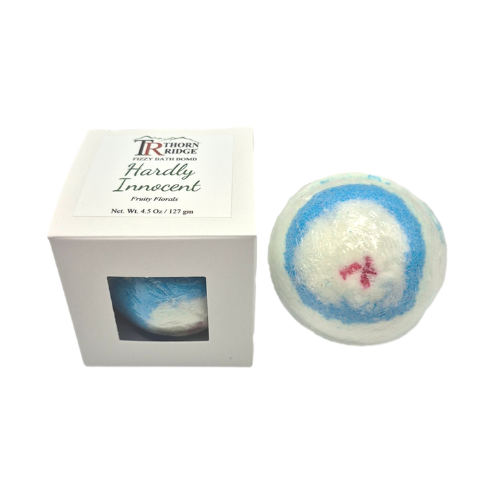 Hardly Innocent bath bomb front with box packaging.