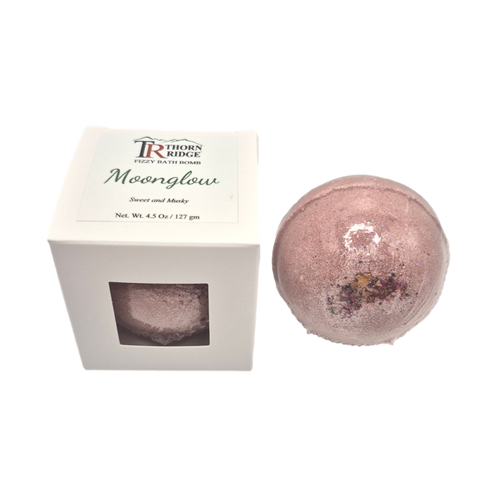 Moonglow bath bomb front with box packaging.