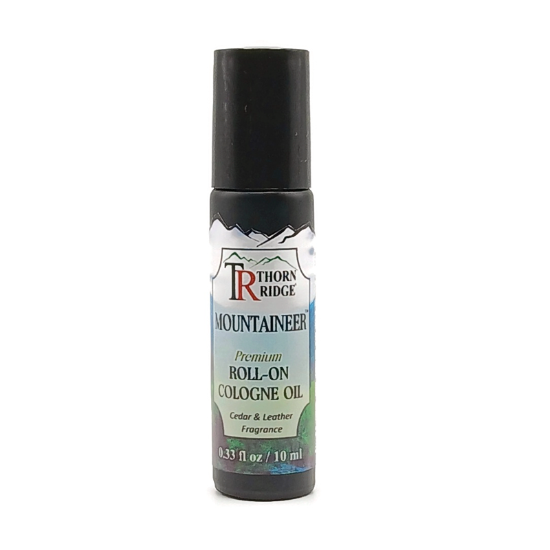 A bottle of Thorn Ridge roll on cologne labeled "Mountaineer," described as a cedar and leather fragrance. 0.33 fl oz, 10 ml.