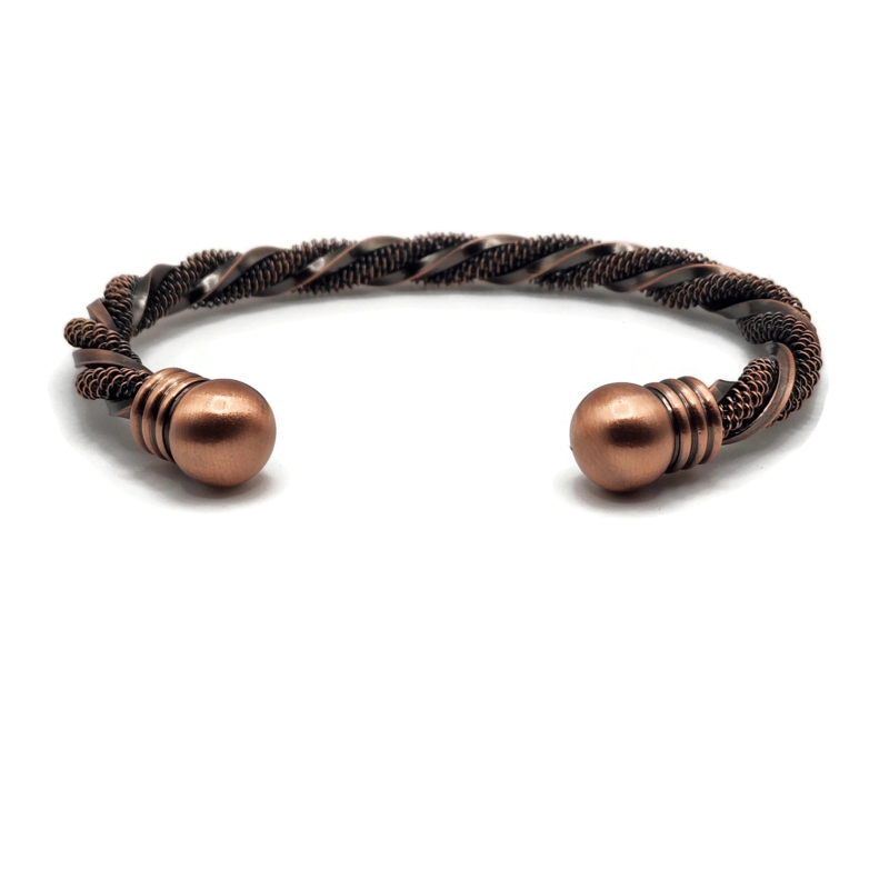Brass twisted bangle bracelet with a manget on each end. One section of brass is textured and the other is smooth.