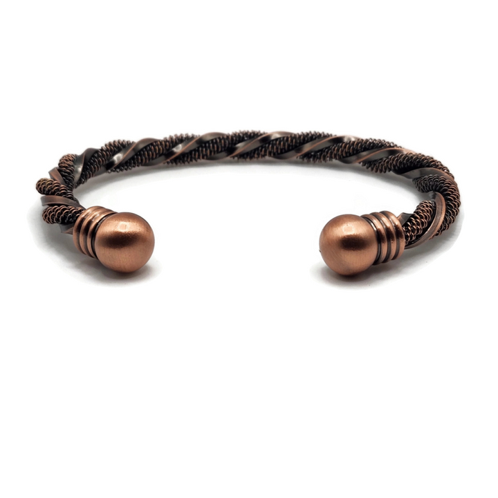 Brass twisted bangle bracelet with a manget on each end. One section of brass is textured and the other is smooth.