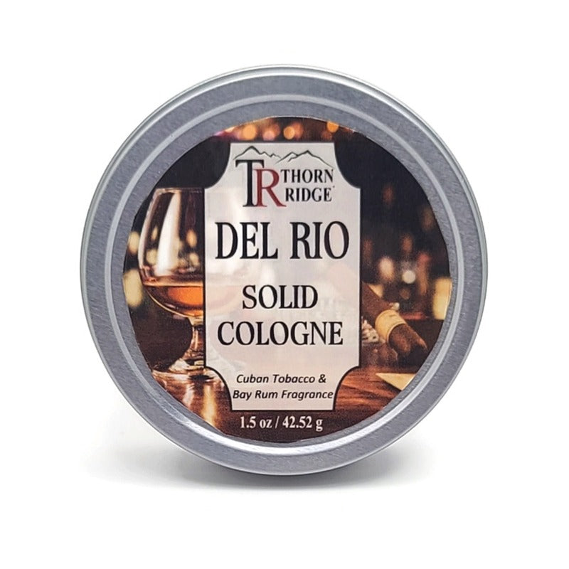 A silver tin of Thorn Ridge solid cologne labeled "Del Rio," described as a Cuban tobacco and bay rum fragrance. 1.5 oz.