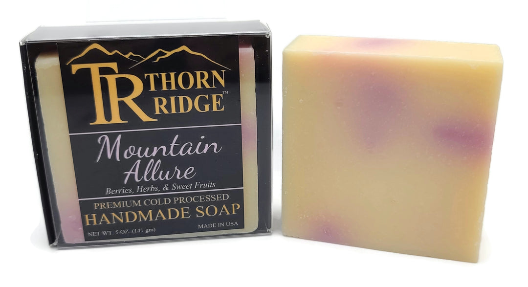Packaging of Thorn Ridge soap labeled "Mountain Allure," described as berries, herbs, sweet fruits, premium cold processed, handmade, 5 oz. Made in USA.