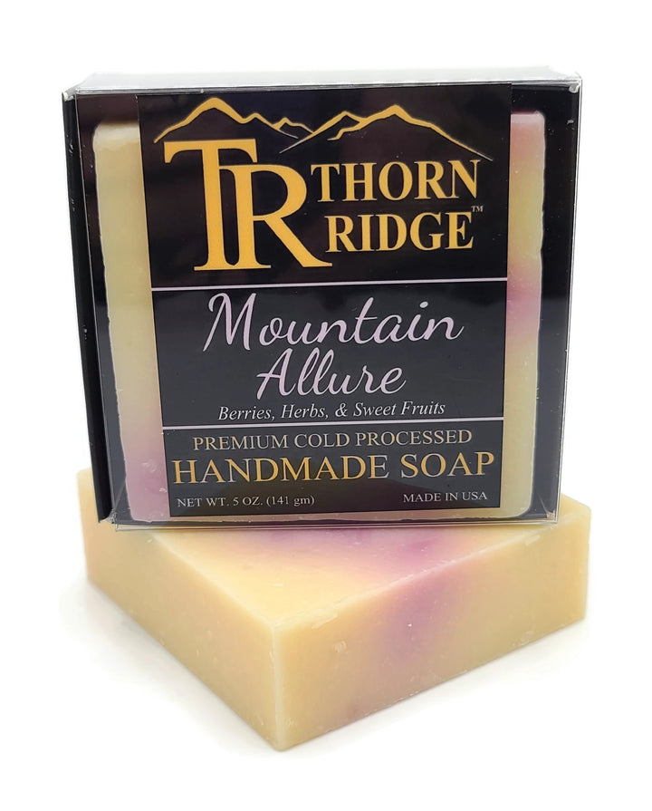 Packaging of Thorn Ridge soap labeled "Mountain Allure," described as berries, herbs, sweet fruits, premium cold processed, handmade, 5 oz. Made in USA.