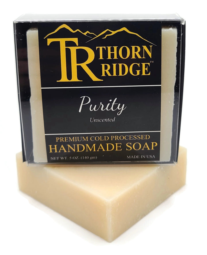 Packaging of Thorn Ridge soap labeled "Purity," described as unscented, premium cold processed, handmade, 5 oz. Made in USA.