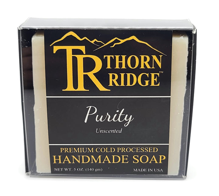 Packaging of Thorn Ridge soap labeled "Purity," described as unscented, premium cold processed, handmade, 5 oz. Made in USA.