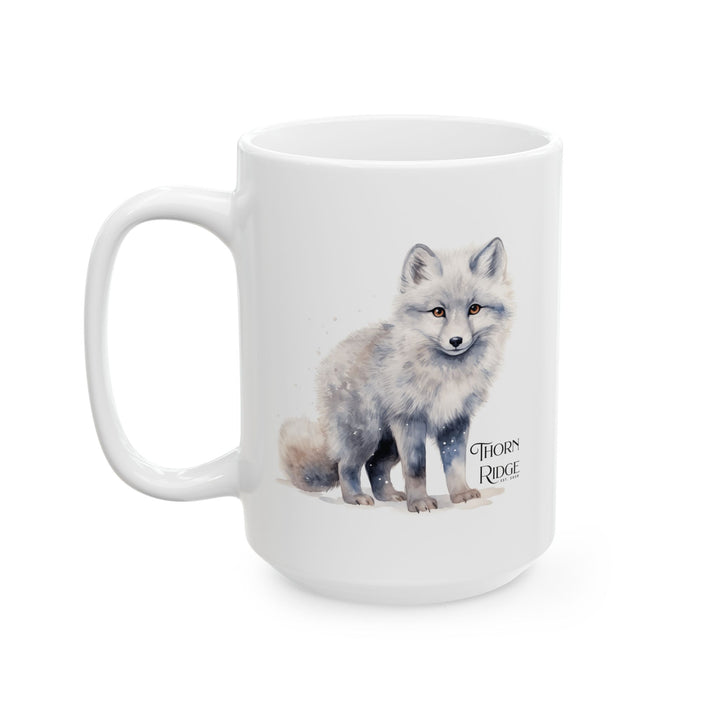 White mug with a graphic of a standing artic fox and 'Thorn Ridge' text on a white background