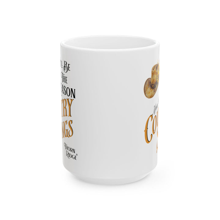 White mug with a cowboy hat and sunflower design, featuring text 'I'll Be The Reason You Write Country Songs' by Thorn Ridge.