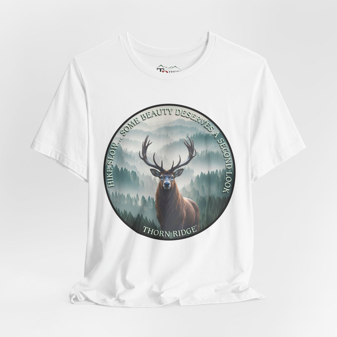 Hike Slow Some Beauty Deserves a Second Look tee with deer and mountains within a circular graphic by Thorn Ridge®
