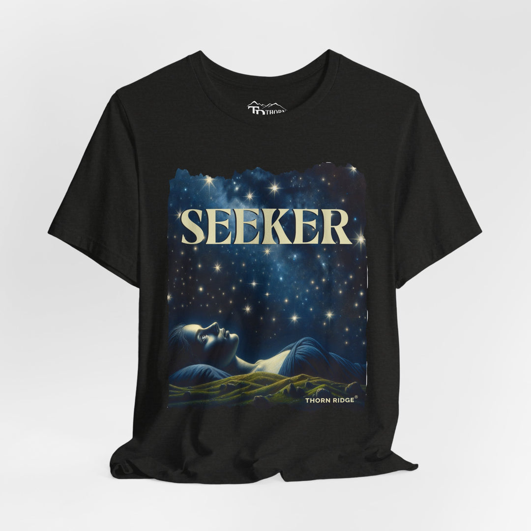 t-shirt labeled Seeker with the graphic of a woman laying on her back looking at the stars labeled Thorn Ridge®