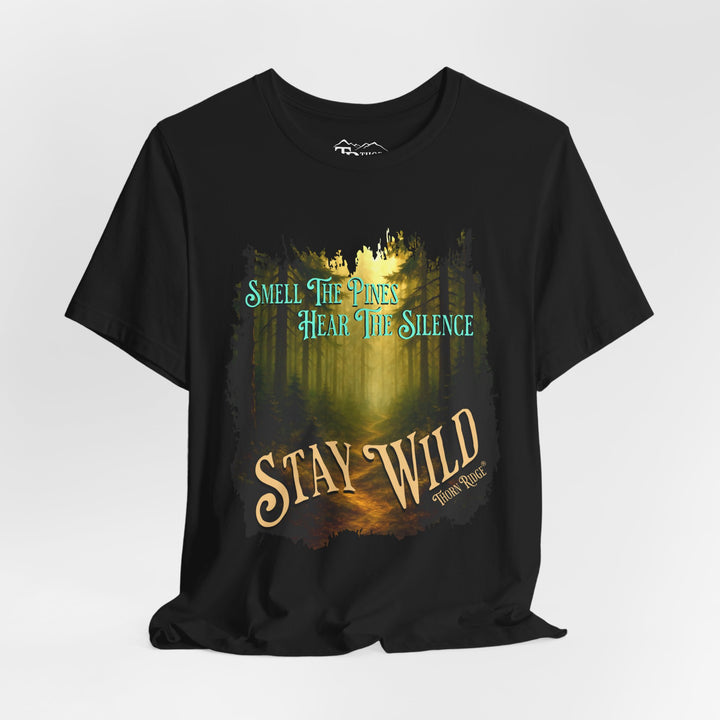 Smell The Pines Hear the Silence Stay Wild graphic tee with the image of a forest path and tall pines labeled Thorn Ridge®