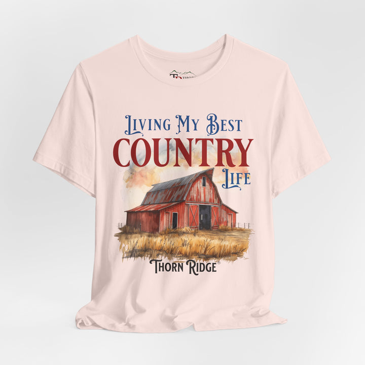 t-shirt with a graphic of a red barn and text 'Living My Best Country Life' branded Thorn Ridge®