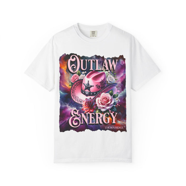 Outlaw Energy graphic tee with a pink cowgirl hat and roses on a celestial background of pinks, blues, and oranges. Labeled Thorn Ridge®