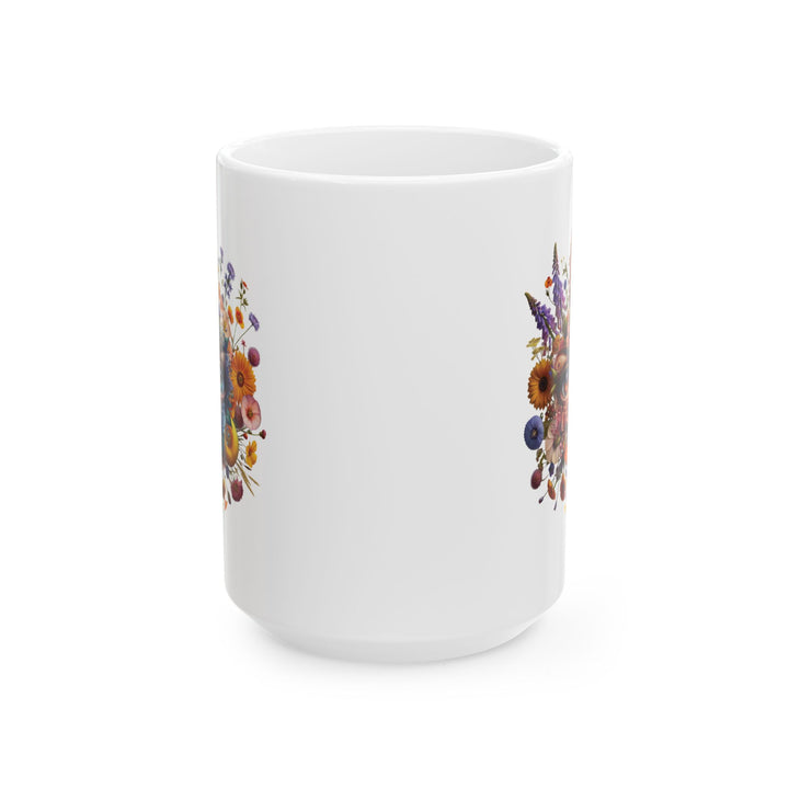 White mug You've Been Gazed with a colorful floral design with eyes gazing out at you from the middle of the flowers and 'Thorn Ridge' branding on a white background