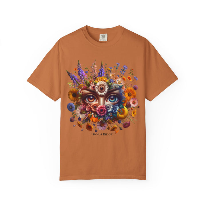 t-shirt with a colorful floral design and eyes in the center that seem like they're watching you. Branded Thorn Ridge®.