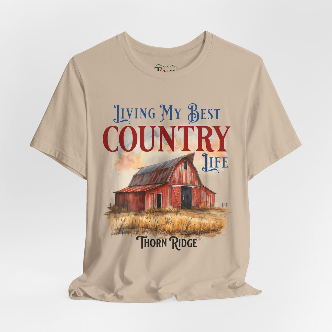 t-shirt with a graphic of a red barn and text 'Living My Best Country Life' branded Thorn Ridge®