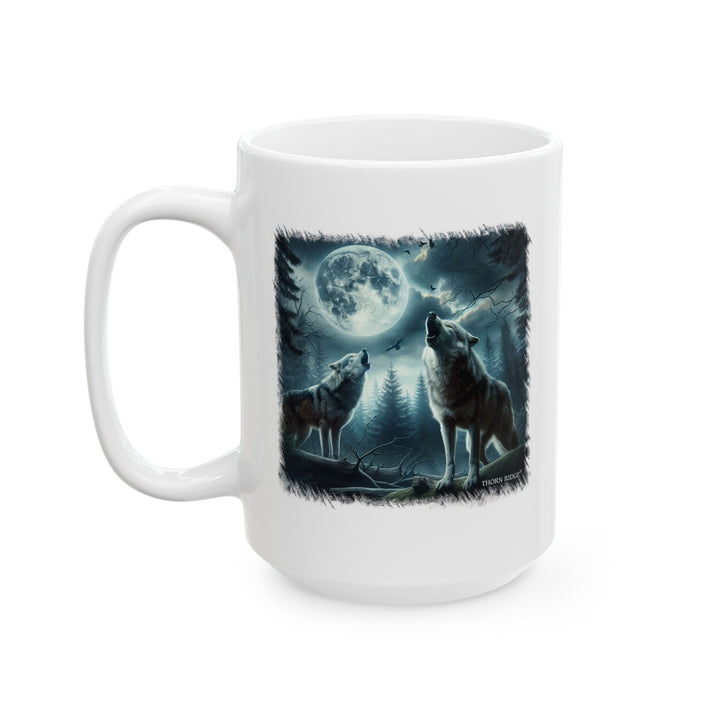 moonlit wolves mug by Thorn Ridge® of two wolves howling at the moon and a cloudy sky.