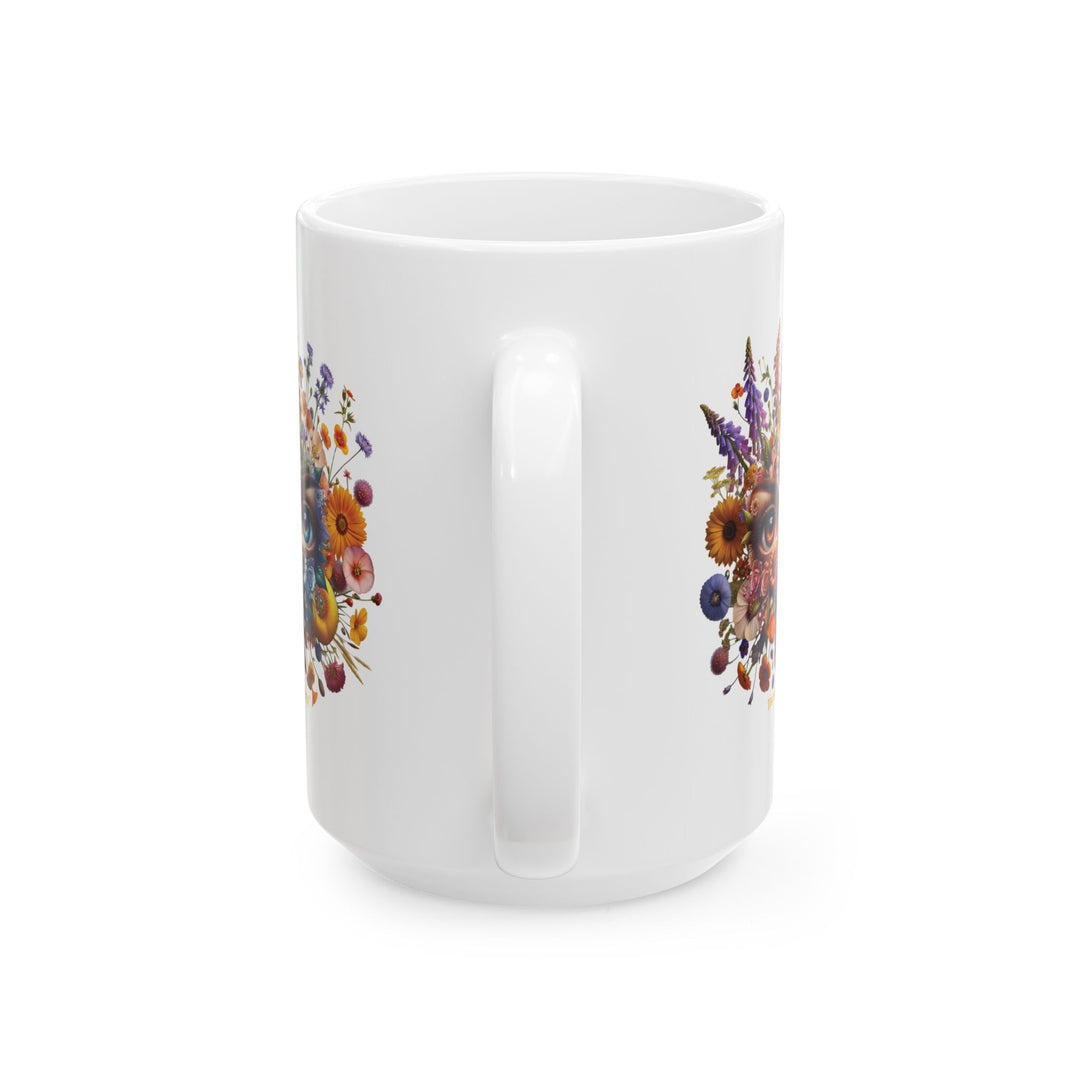 White mug You've Been Gazed with a colorful floral design with eyes gazing out at you from the middle of the flowers and 'Thorn Ridge' branding on a white background