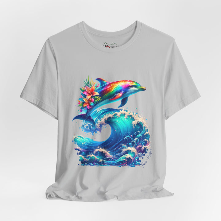 Colorful rainbow dolphin with flowers on its back near its tail jumping over a curling ocean wave. Labeled Thorn Ridge®. 