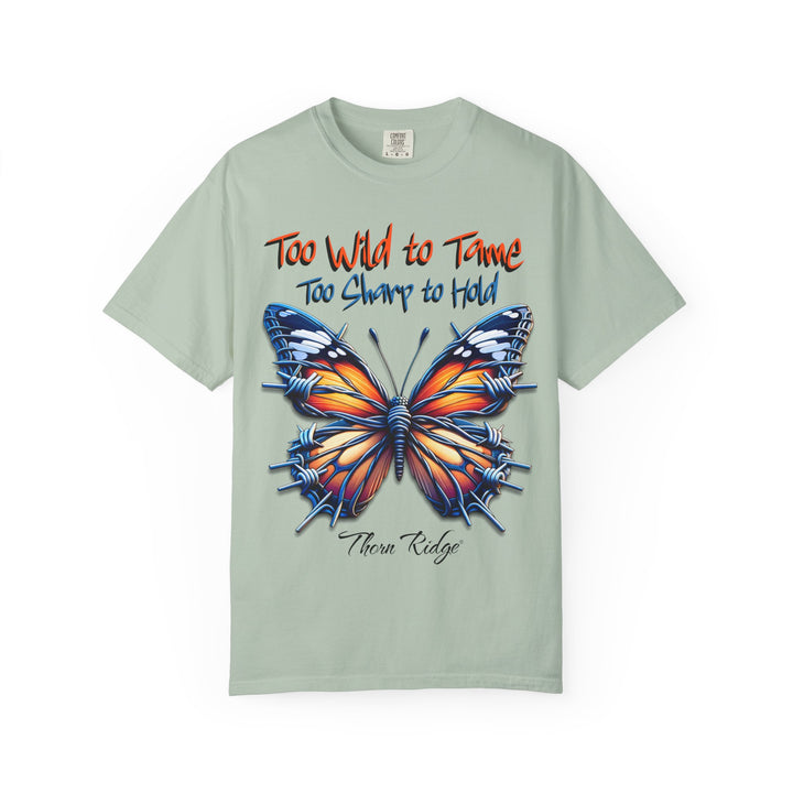 Too Wild To Tame Too Sharp To Hold Graphic Tee with a butterfly with barbed wire wings labeled Thorn Ridge. 